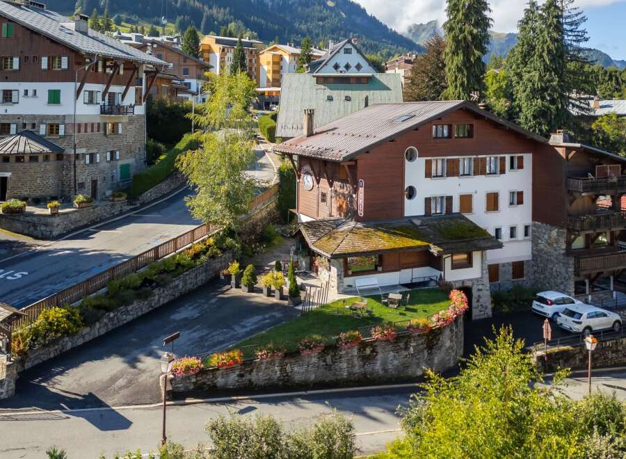 Nestled in a picturesque village, this charming property boasts traditional architecture and stunning mountain views.