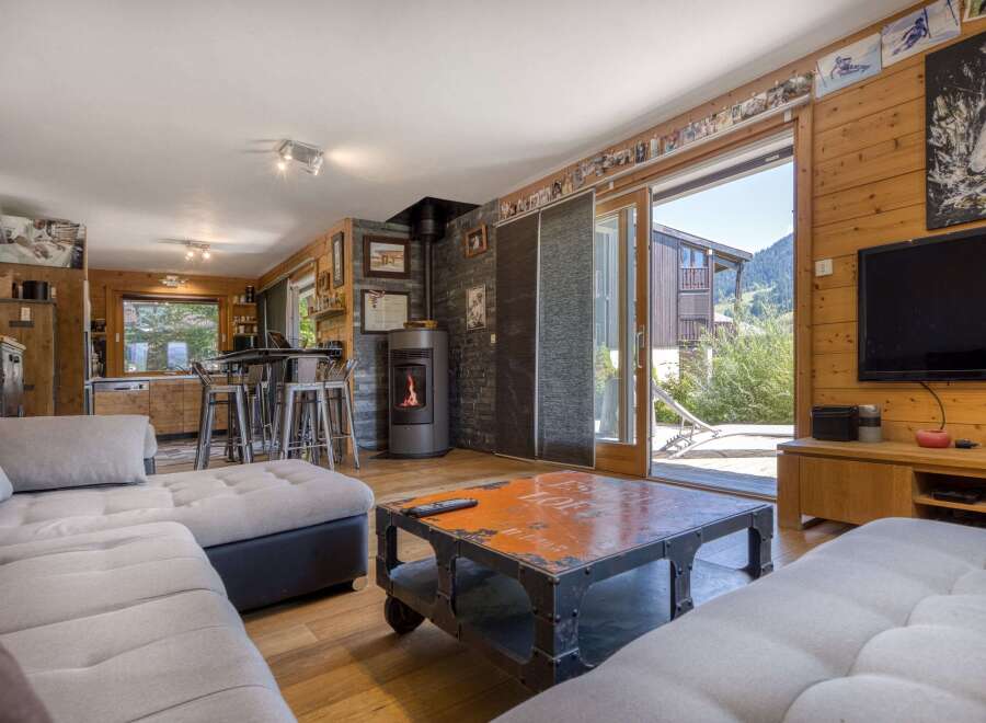 This stunning property boasts a cozy living room with a modern fireplace, perfect for relaxing evenings.