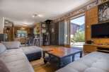 This stunning property boasts a cozy living room with a modern fireplace, perfect for relaxing evenings.