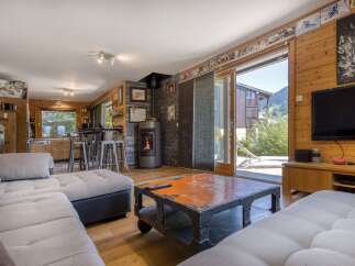 This stunning property boasts a cozy living room with a modern fireplace, perfect for relaxing evenings.