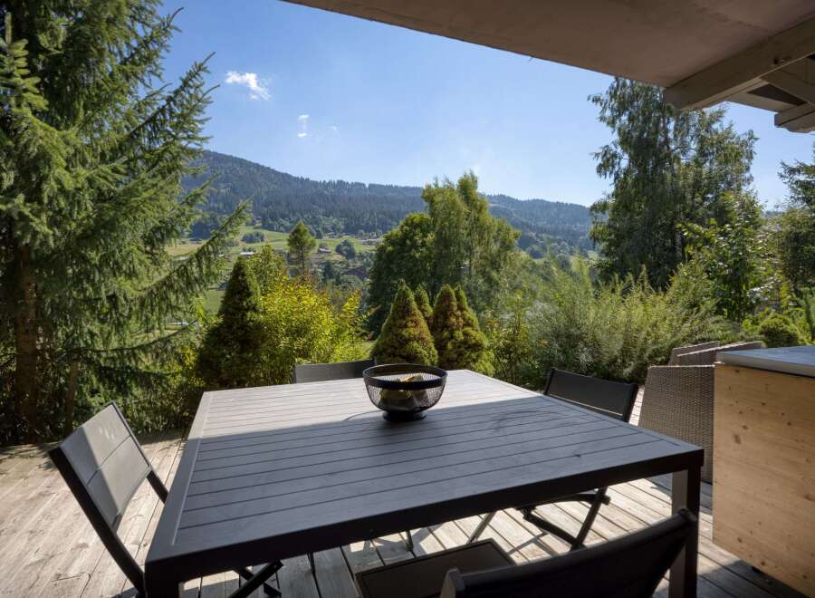Enjoy breathtaking mountain views from this stunning outdoor dining area.