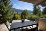 Enjoy breathtaking mountain views from this stunning outdoor dining area.