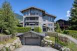 This stunning wooden chalet offers a luxurious retreat with its spacious design and breathtaking mountain views.