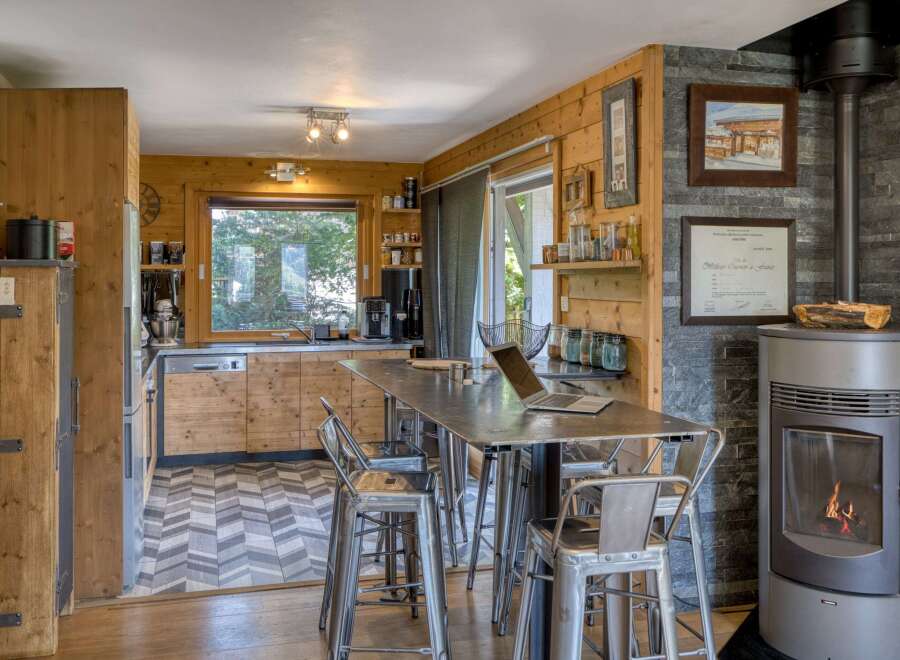 This stunning kitchen boasts a rustic charm with its wooden cabinetry and flooring.