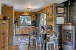 This stunning kitchen boasts a rustic charm with its wooden cabinetry and flooring.