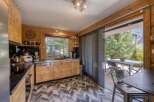 This stunning kitchen boasts a modern design with wooden cabinetry and a sleek countertop.