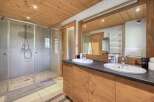 This stunning bathroom features a modern design with a touch of rustic charm.