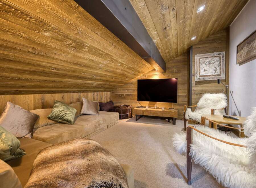 This cozy living space features a warm, wooden interior, creating a rustic and inviting atmosphere.