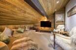 This cozy living space features a warm, wooden interior, creating a rustic and inviting atmosphere.