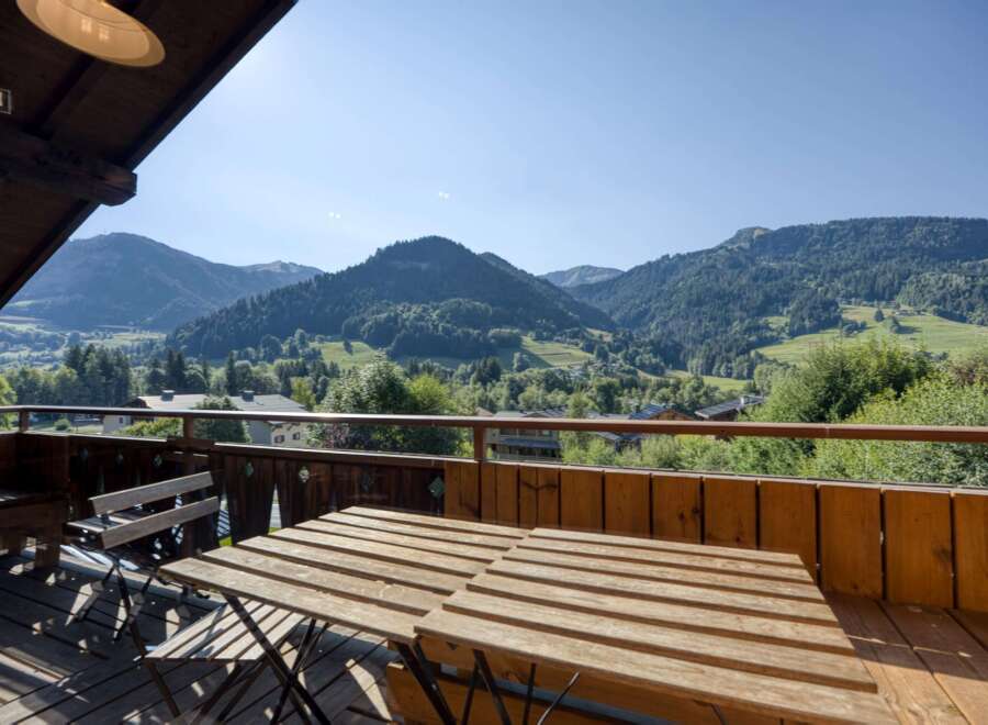 Enjoy breathtaking mountain views from this charming balcony.
