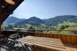 Enjoy breathtaking mountain views from this charming balcony.
