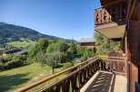 Enjoy breathtaking mountain views from this charming balcony.