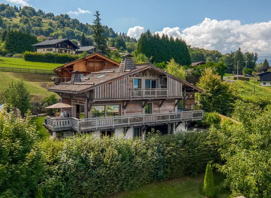 This stunning wooden chalet offers a luxurious retreat in a picturesque setting.