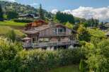 This stunning wooden chalet offers a luxurious retreat in a picturesque setting.