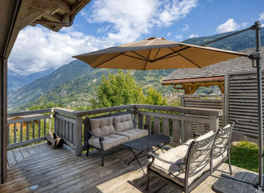 Enjoy breathtaking mountain views from this charming outdoor patio.