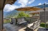 Enjoy breathtaking mountain views from this charming outdoor patio.