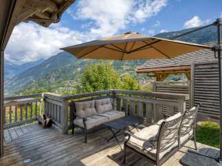 Enjoy breathtaking mountain views from this charming outdoor patio.