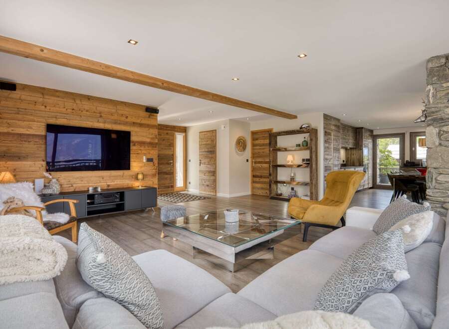 Experience luxury living in this stunning property, featuring a spacious living room with a modern design.