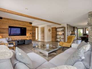 Experience luxury living in this stunning property, featuring a spacious living room with a modern design.