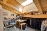 This charming attic space offers a unique blend of functionality and style, perfect for a home office or creative studio.