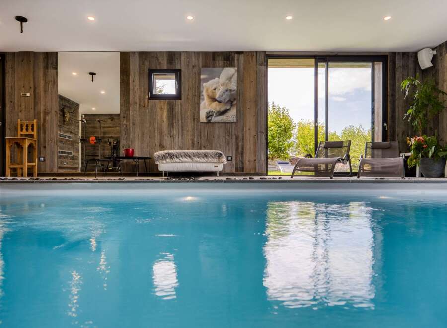 Experience luxury and relaxation in this stunning indoor pool area.