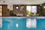 Experience luxury and relaxation in this stunning indoor pool area.