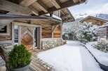 Experience the charm of this stunning wooden chalet nestled in a winter wonderland.