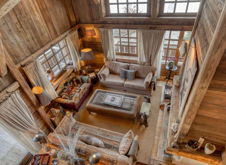 Step into rustic elegance with this stunning property, showcasing exquisite wooden architecture and a warm, inviting ambiance.