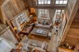 Step into rustic elegance with this stunning property, showcasing exquisite wooden architecture and a warm, inviting ambiance.