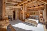 Step into rustic elegance with this stunning wooden bedroom.