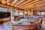Experience luxury living in this stunning property, featuring a beautifully designed interior with exposed wooden beams and elegant furnishings.