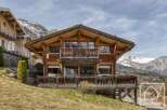 Discover the charm of this stunning wooden chalet nestled in the mountains.