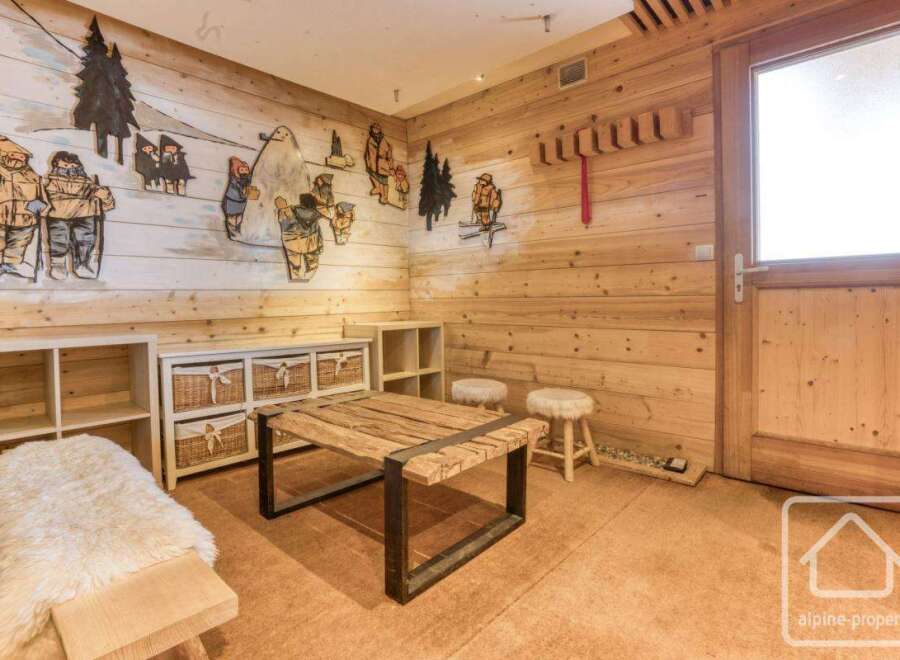 This cozy room features a rustic wooden interior, creating a warm and inviting atmosphere.