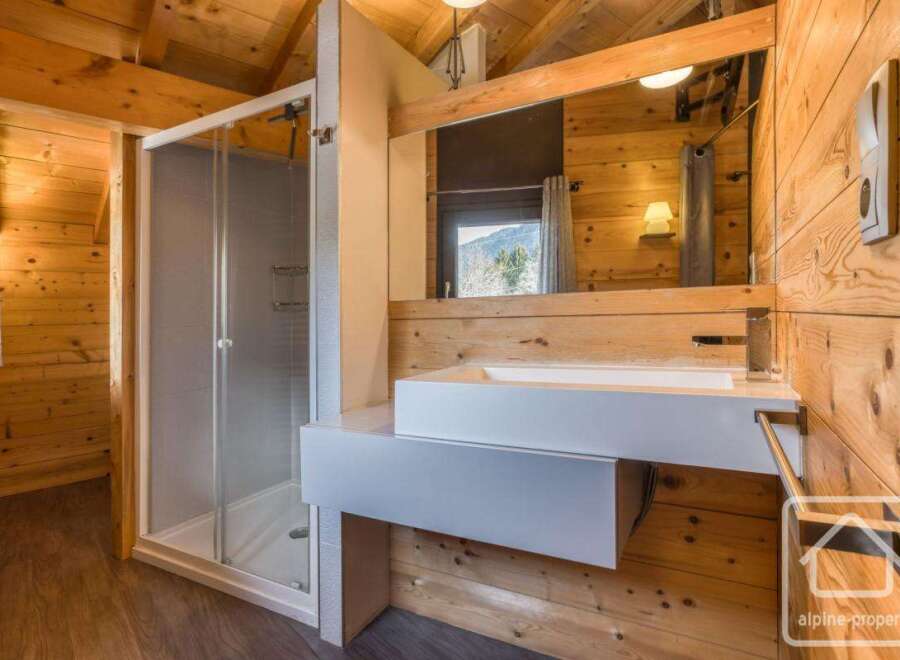 This stunning bathroom features a modern design with a touch of rustic charm.