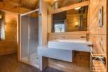 This stunning bathroom features a modern design with a touch of rustic charm.