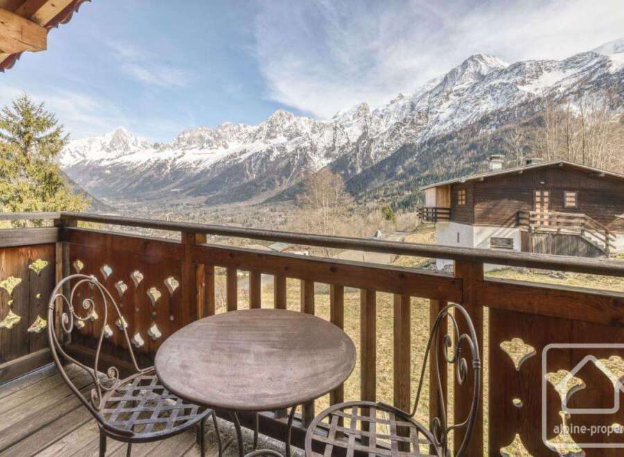 Enjoy breathtaking mountain views from this charming balcony.