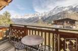 Enjoy breathtaking mountain views from this charming balcony.