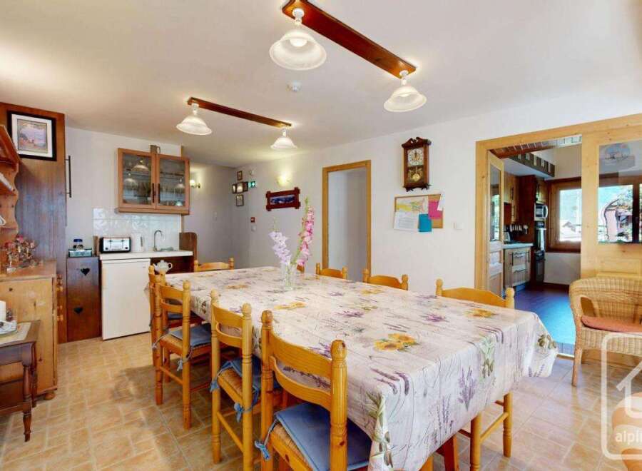 This charming property features a spacious dining area, perfect for family gatherings.