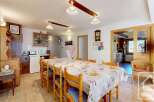 This charming property features a spacious dining area, perfect for family gatherings.