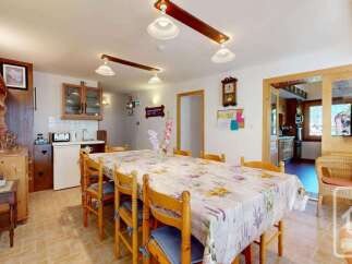 This charming property features a spacious dining area, perfect for family gatherings.