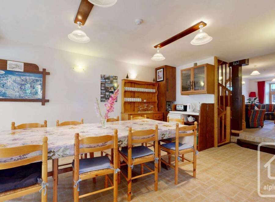 This charming property features a spacious dining area, perfect for family gatherings.