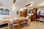 This charming property features a spacious dining area, perfect for family gatherings.