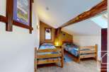 Discover this charming attic bedroom, perfect for a cozy retreat.