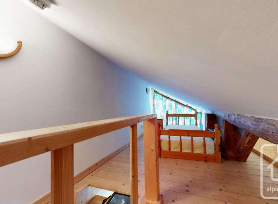 Discover the charm of this unique attic space, perfect for a cozy bedroom or a creative retreat.