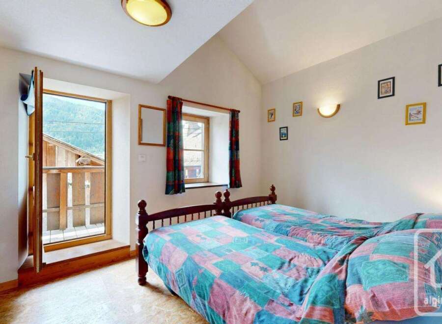 Discover the charm of this cozy bedroom, perfect for a relaxing retreat.
