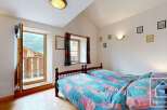 Discover the charm of this cozy bedroom, perfect for a relaxing retreat.