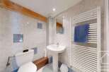 This charming bathroom features a clean and modern design, perfect for a comfortable living space.