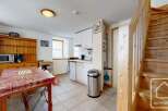 Discover the charm of this cozy property, featuring a well-equipped kitchen with modern appliances and ample storage.