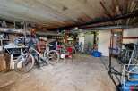 Discover this spacious property with ample storage space, perfect for a workshop or hobby area.