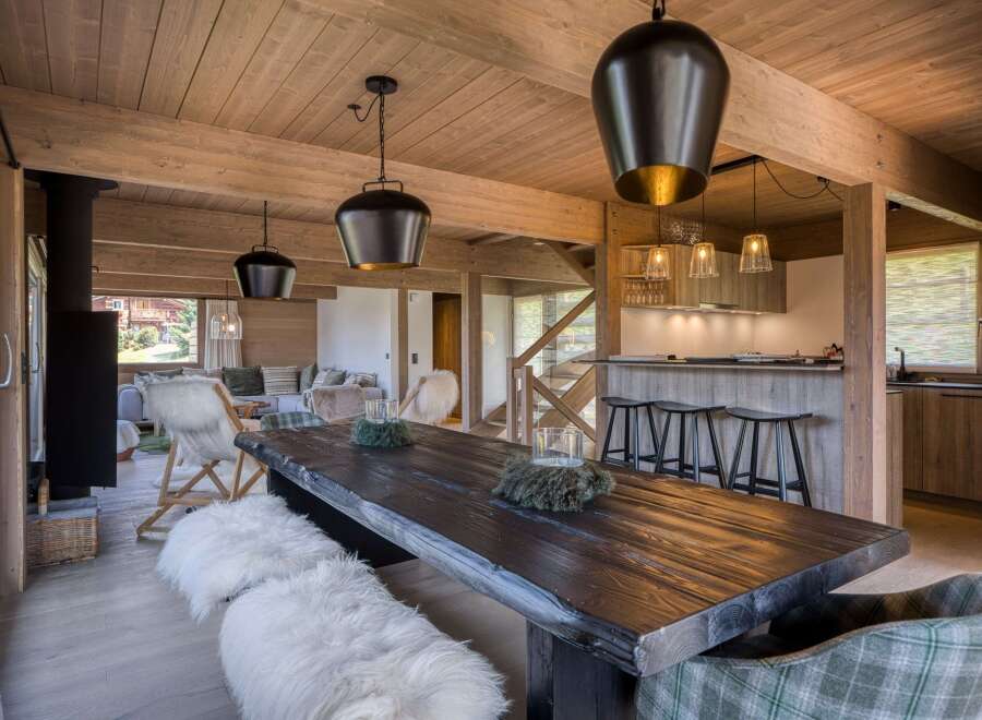 This stunning property boasts a rustic dining area, perfect for hosting gatherings.